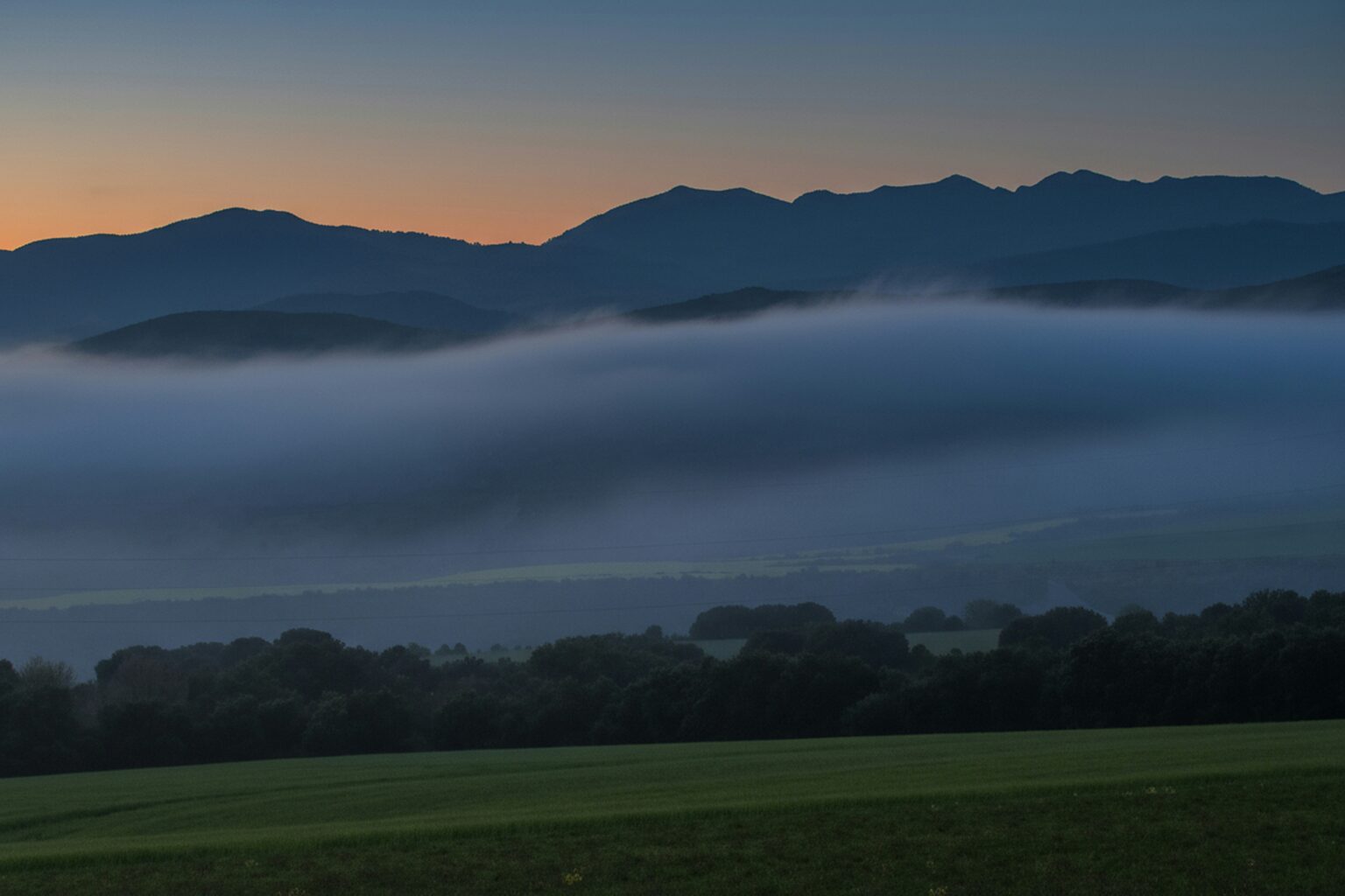 Misty mountain valley at dawn